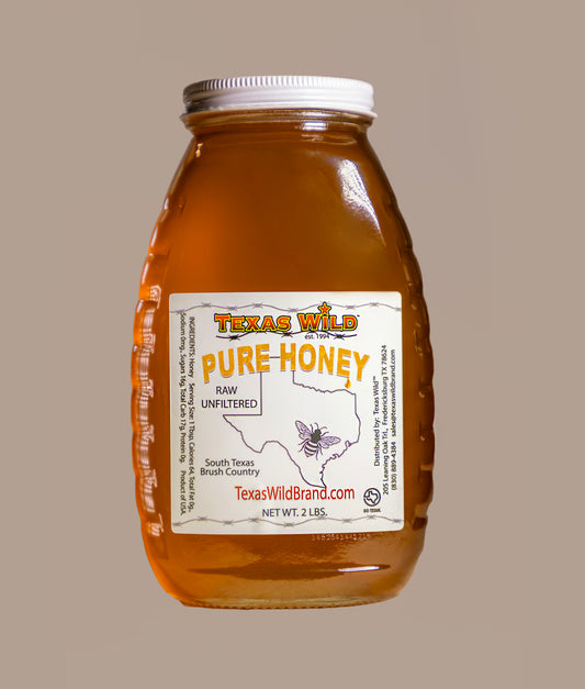 2 lb of Pure Texas raw honey in a glass container,  created by a multi generational Tx family of beekeepers since 1929.  View details at TexasWildBrand.com 
